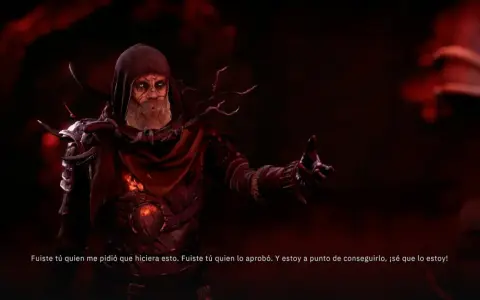 Un hechicero con túnica roja y ojos brillantes, en Tainted Grail: The Fall of Avalon, habla con un gesto amenazante.