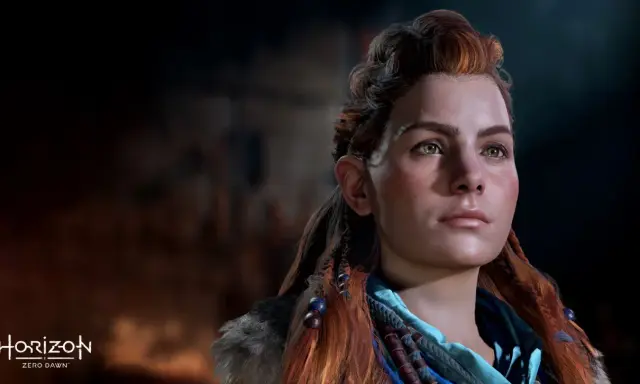 Aloy, protagonista de Horizon Zero Dawn 2, mira al horizonte con determinación. Su cabello pelirrojo trenzado y su mirada penetrante transmiten fuerza.