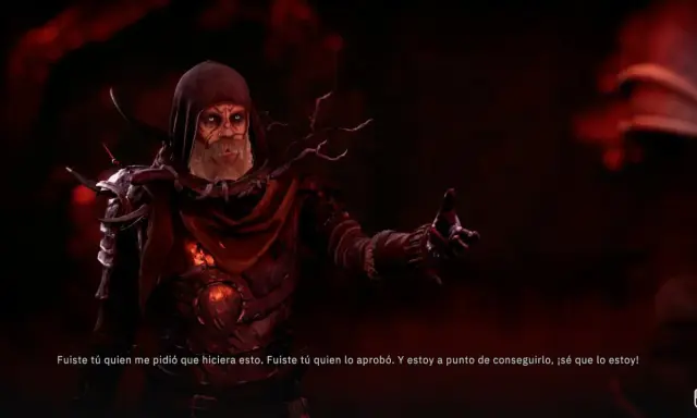 Un hechicero con túnica roja y ojos brillantes, en Tainted Grail: The Fall of Avalon, habla con un gesto amenazante.