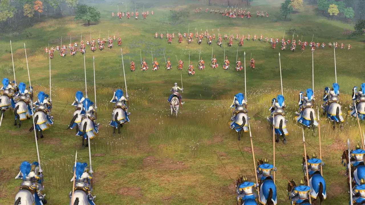 Caballer&iacute;a lista para la batalla en Age of Empires 4. Un ej&eacute;rcito se prepara en un campo verde, con lanzas apuntando al cielo.